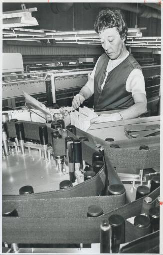 Catching the code: The nimble fingers of Marie Bright remove the mail from a code-reading machine after the letters have been transported via high-speed conveyor belts from the sorting office