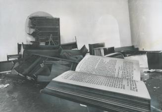 Protestant chapel was completely destroyed by the 500 rioting inmates at Kingston Penitentiary although the Bible was left intact. Pews were smashed a(...)