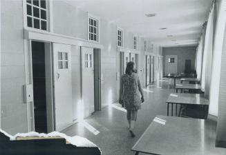 Lonely inmate walks down the corridor of the reception area at the Galt institution