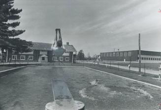 The only fence in this prison is to protect inmates from the dangers of swimming pools