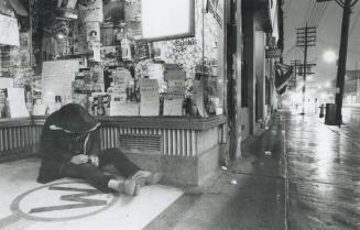 Hearth of darkness: One of the estimated 14,000 to 20,000 persons opposition critics say now are living on the streets of Metro Toronto