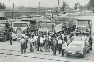 On strike to gain recognition of their newly formed Ontario Hauler Association, 20 gravel haulers park their trucks next to the stouffville Auction Ba(...)