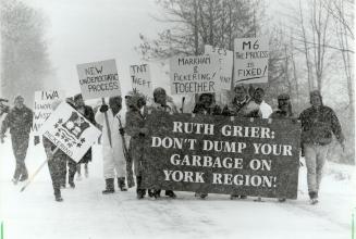 Strong message: Residents of Pickering and Markham join their mayors yesterday at the Mark-ham-Pickering Town Line, south of Highway 7, to launch a campaign to fight proposed dump sites