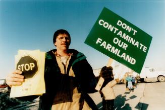 Paper trail: Farmer Don Whitcombe indicates his opinion about the use of paper sludge as fertilizer at a protest outside Atlantic Packaging in Whitby