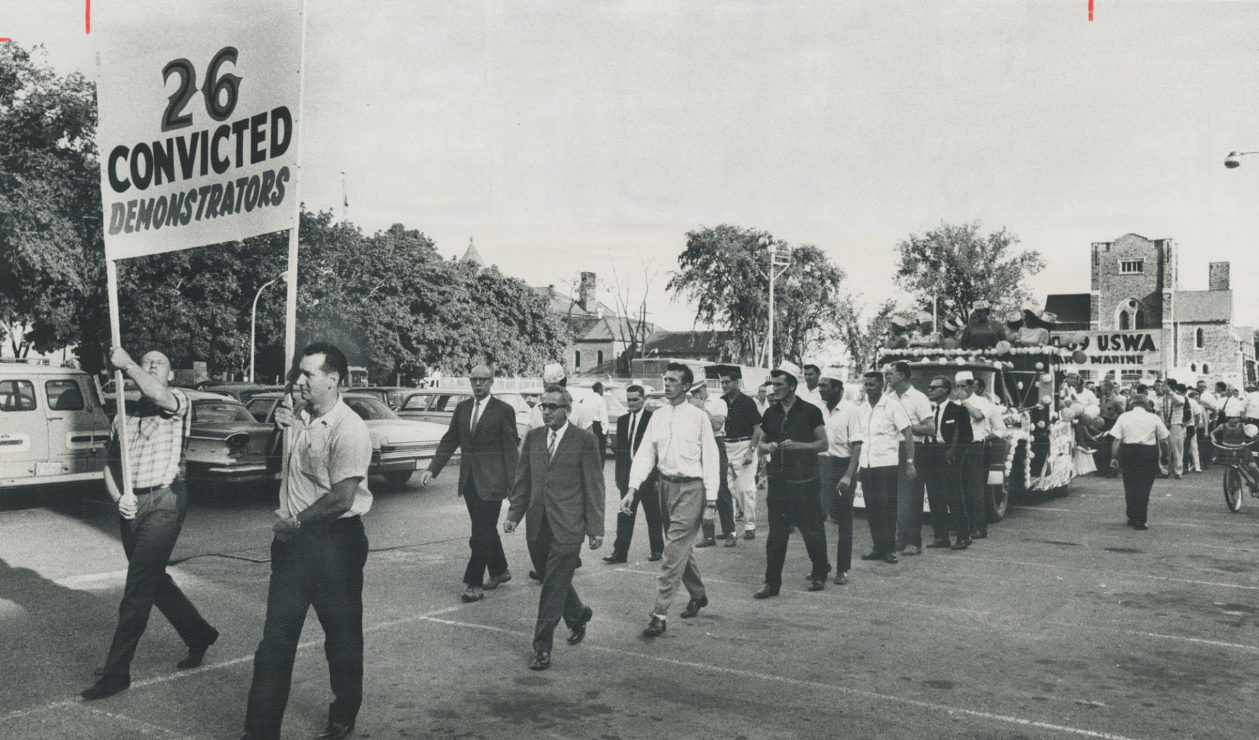 The 26 convicted demonstrators take part in tilco strikers' parade through streets of peterborough yesterday, Unionists from Hamilton, Oshawa, Kingsto(...)