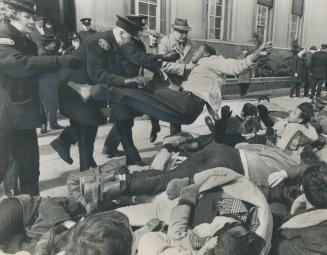 Police Heaveto is given a Negro youth who was among about 80 student demonstrators who marched on the U