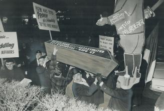 Two Innocent Bystanders, Metro Chairman William Allen and wife leave Yugoslav consulate on Spadina Rd