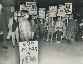 The 'M' got left behind, Union Station was alive with sign-carrying demonstrators this morning as more than 1,200 persons left for Ottawa to take part in protest march against the war in Viet Nam