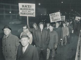 Silent Marchers parade past the CBC headquarters on Jarvis St