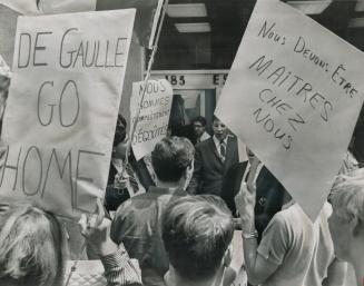 Go home de Gaulle says the banner of a group of university students protesting outside the French Consulate on Bay St