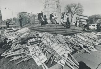 The signs of a demonstration against the Viet Nam war lie stacked around war memorial on University Ave