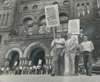 Demanding Action: Members of Bruno Zanini's independent Canadian Concrete Forming Workers Union parade outside Queen's Park today