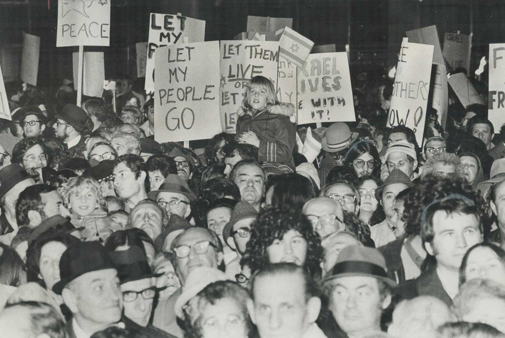Ten thousand persons jam Nathan Phillips Square Saturday night for a rally organized by the Canada-Israel Committee to show concern for Soviet Jews an(...)