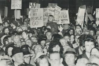 Ten thousand persons jam Nathan Phillips Square Saturday night for a rally organized by the Canada-Israel Committee to show concern for Soviet Jews an(...)