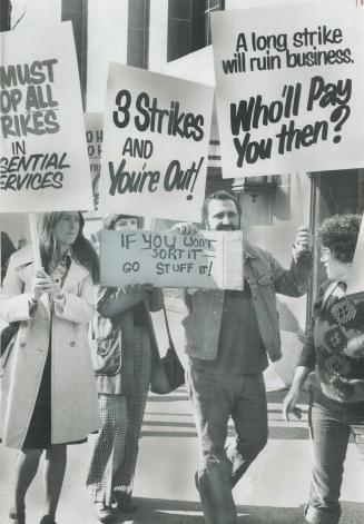 Representing Businesses hurt by the postal strike, about 75 pickets march outside the Royal York Hotel yesterday, across Front St. from striking postal workers and sympathizers. [Incomplete]