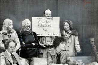 Teachers and parents crowded a meeting of the Toronto Board of Education last week protesting the planned firing of 135 teachers. Seated, in front, ar(...)