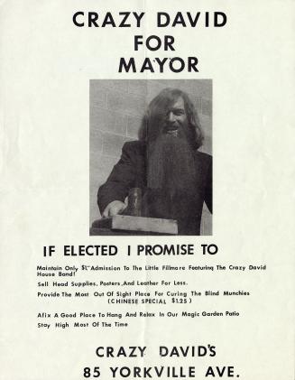 A poster with a photograph of a man with long hair and beard.