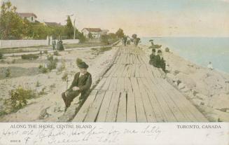 Colourized photograph of people sitting on a boardwalk near a lake