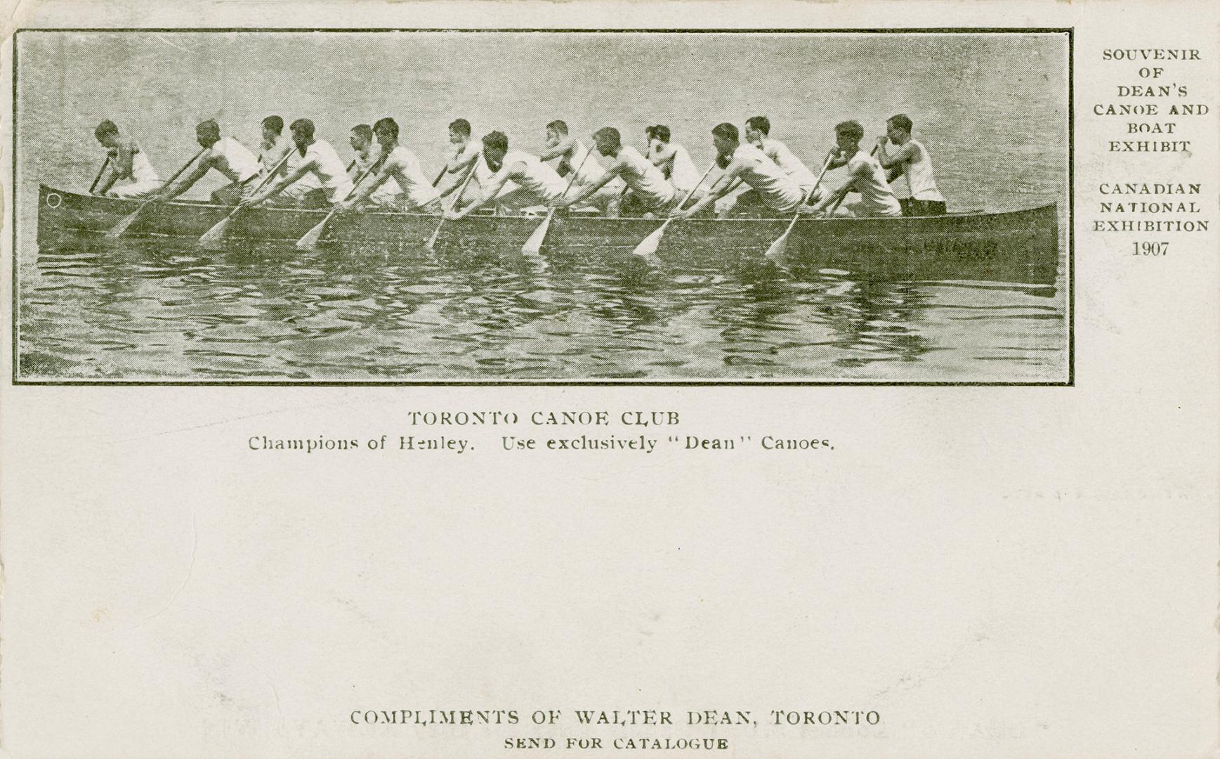 Black and white picture of fifteen canoeists paddling in a large canoe.