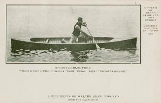 Black and white picture of a man on his knees paddling a canoe.