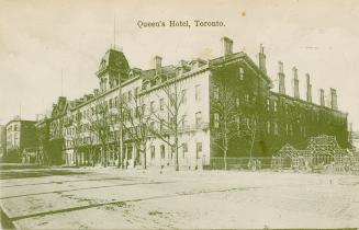 Black and white photograph of a four story hotel.