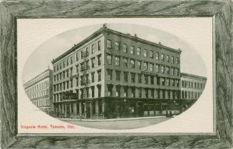 Black and white picture of a five story hotel building. Picture has a woodgrain border.