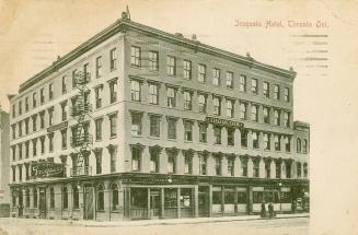 Black and white photograph of a five story hotel building.