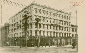 Black and white photograph of a five story hotel building.