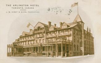Picture shows a four story hotel building with a front veranda,