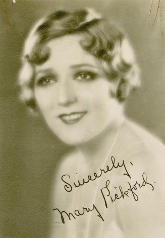 Portrait of Mary Pickford, short hair with finger waves.