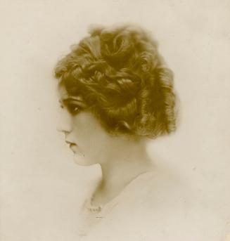 Profile portrait of Mary Pickford looking to the left.