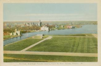Toronto Island airport, with the downtown cityscape in the background. There is only one tall b…