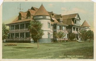 A color picture of a large Victorian house.
