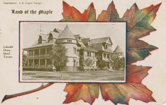 Black and white picture of a large Victorian house on top of an orange maple leaf.