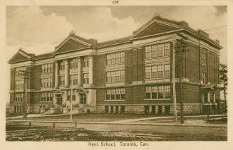Sepia toned photograph of a three story school building with columns over the front door.
