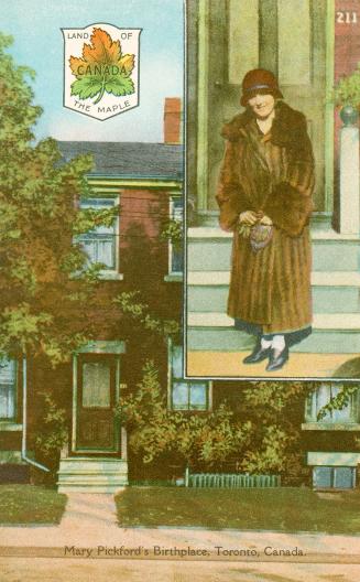Mary Pickford standing in front of the house where she was born.
