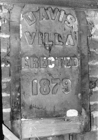 A photograph of an erection plaque reading &quot;Davis Villa Erected 1879.&quot;