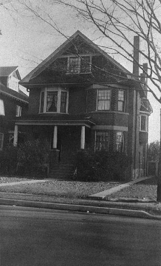 A photograph of a two-story house.