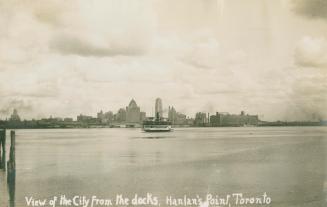 Black and white photo postcard of the Toronto cityscape as seen from Hanlan's Point, with Lake  ...