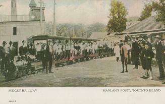 Colour photo postcard of the open-air passenger train at Hanlan's Point, called the "Midge…
