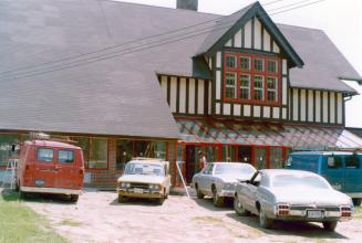 Three cars and a van parked out front of Main Street branch