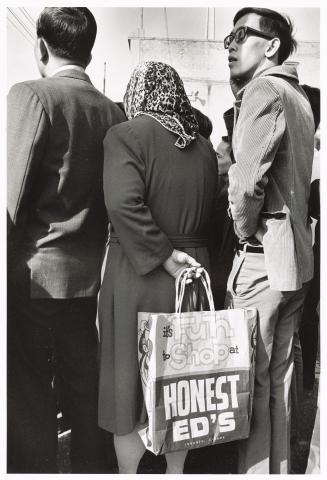 A photograph of spectators at an outdoor event in downtown Toronto.