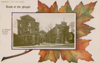 A black and white picture of a large hospital set on top of a green and orange maple leaf.