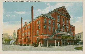 Color picture of a large music hall with prominent fire escapes.
