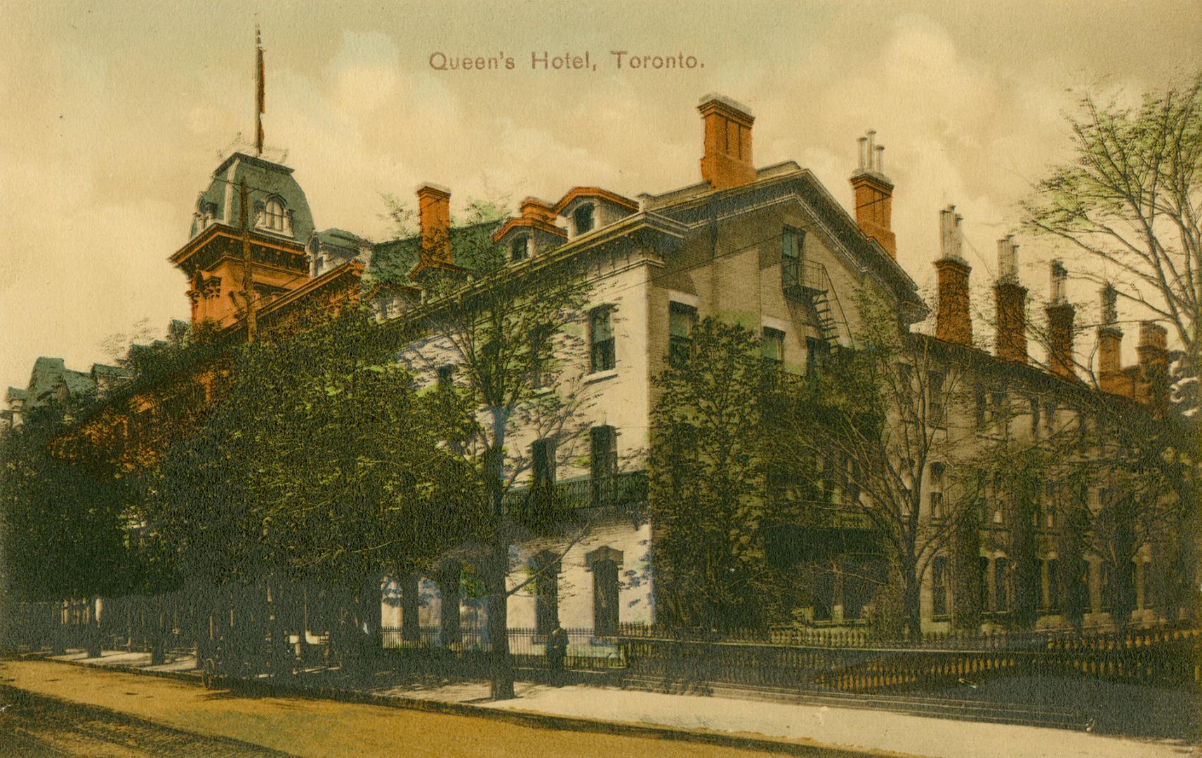 Colorized photograph of a four story hotel.