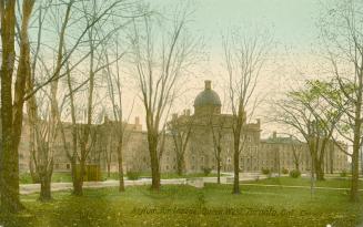 Colorized photograph of large hospital building with and front lawn.