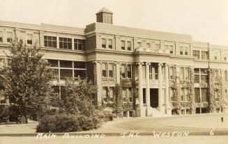 Black and white photograph of a three story hospital building.