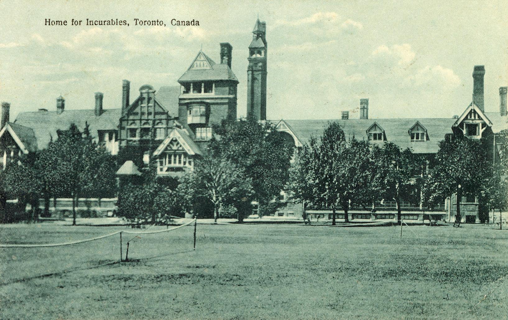 Black and white picture of a large hospital building and grounds.