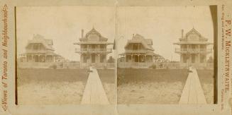 Pictures show two Victorian cottages on a beach with a boardwalk leading up to them.