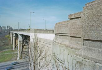 A photograph, facing west, of a bridge across the Don Valley in Toronto.
